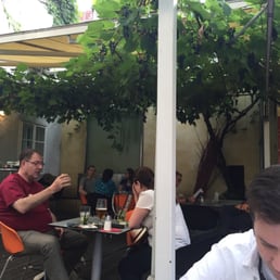 Outside area. Under the grapevines. Divine.