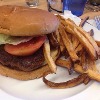 The Serving Spoon - Spicy beef sausage burger with fries. - Breakfast & Brunch Near Me - Inglewood, California
