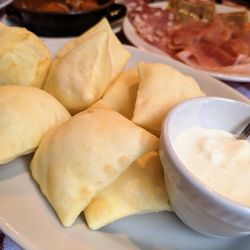 Trattoria del Rosso - Crescentine: fried rectangles of dough found in Bologna, typically served with cheese sauce (pictured) and sliced meats