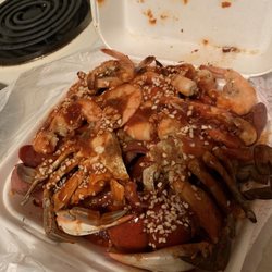 Bo Bo Seafood - Low country boil with hot sauce, seasoning and garlic. Crab, shrimp, potatoes, sausage, corn