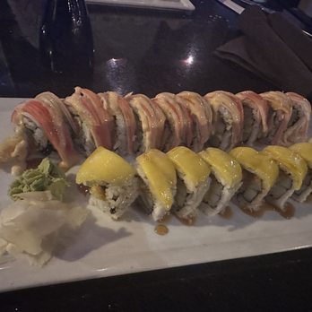 Kabuki - On top is a kani dragon roll The yellow one is a Mango Tango Roll - Sushi Bars Near Me - Palm Beach Gardens, Florida Kabuki - On top is a kani dragon roll The yellow one is a Mango Tango Roll - Sushi Bars Near Me - Palm Beach Gardens, Florida