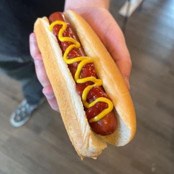 Gatti’s H.O.G. - ows a person holding a hotdog with mustard on it - Hot Dogs Near Me - Charleston, South Carolina Gatti’s H.O.G. - ows a person holding a hotdog with mustard on it - Hot Dogs Near Me - Charleston, South Carolina