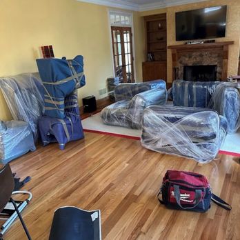 Budget Moving Services - Furniture in our living room that was wrapped up with shrink wrapped and with padded moving blankets - Movers Near Me - Lawrenceville, Georgia Budget Moving Services - Furniture in our living room that was wrapped up with shrink wrapped and with padded moving blankets - Movers Near Me - Lawrenceville, Georgia