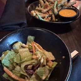 It's a Cesar salad with crispy green beans appetizer. It's a Cesar salad with crispy green beans appetizer.