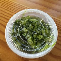 Kind of like chimichurri - garlic and possibly parsley or cilantro?! Either way it's delicious. Kind of like chimichurri - garlic and possibly parsley or cilantro?! Either way it's delicious.