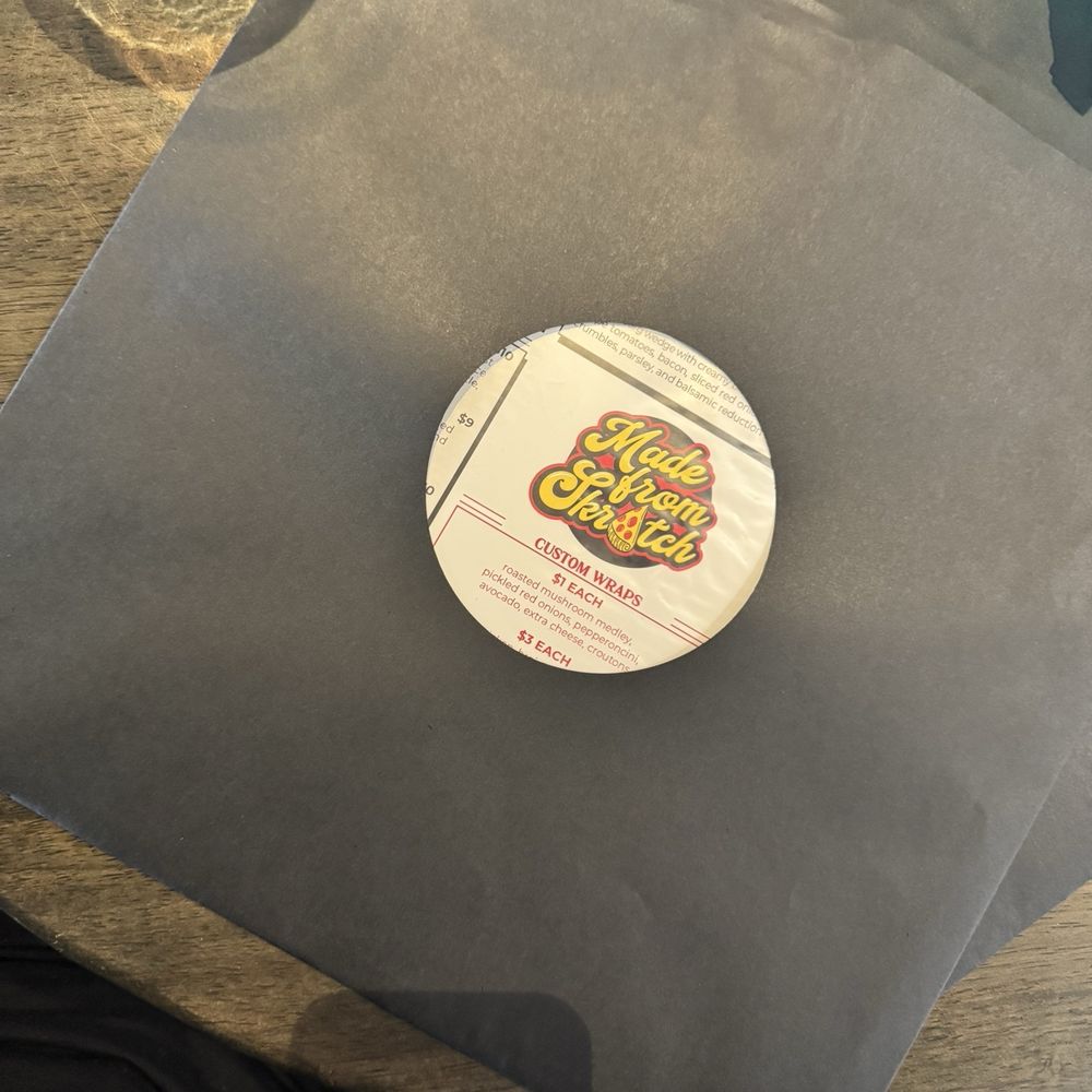 Menu comes in a vinyl record style Menu comes in a vinyl record style
