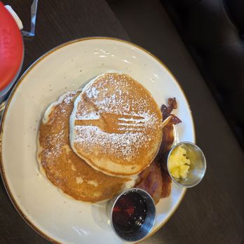Twisted Fork Brunch Company - Pancakes with powdered sugar and bacon - Breakfast & Brunch Near Me - Bellmore, New York Twisted Fork Brunch Company - Pancakes with powdered sugar and bacon - Breakfast & Brunch Near Me - Bellmore, New York