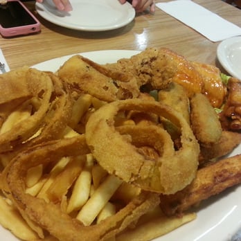 Uncle Pete's Cafe - Combo platter: onion rings, French fries, fried zucchini, wings, and chicken tenders - American Near Me - Westminster, California