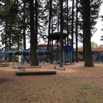 Peninsula Park - Largest play structure to the left. Community center in the background. - Parks Near Me - Portland, Oregon Peninsula Park - Largest play structure to the left. Community center in the background. - Parks Near Me - Portland, Oregon