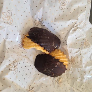 Pasticceria Pitteri - Orange cookies dipped in dark chocolate. Hmm...it looks like someone took a bite out of one of the cookies. - Bakeries Near Me - Venezia, VE Pasticceria Pitteri - Orange cookies dipped in dark chocolate. Hmm...it looks like someone took a bite out of one of the cookies. - Bakeries Near Me - Venezia, VE