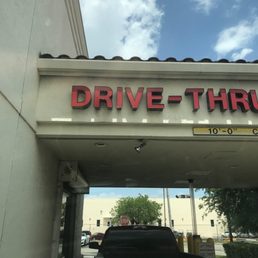 a drive thru sign on a building a drive thru sign on a building