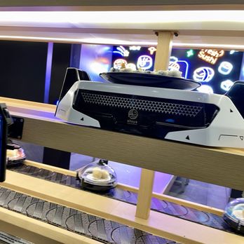 Shoya Revolving Sushi - Robot delivering our a la carte order - Sushi Bars Near Me - Indianapolis, Indiana Shoya Revolving Sushi - Robot delivering our a la carte order - Sushi Bars Near Me - Indianapolis, Indiana