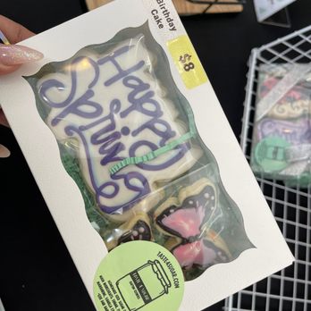 Taste 4 Sugar - a person holding a package of cookies - Desserts Near Me