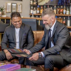 Eastin Suits - Customer looking at different fabrics