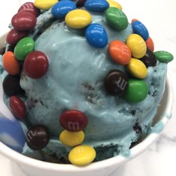 A small with Butter Scotch (bottom) & Cookie Monster (top) topped with M&M's