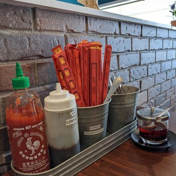 Vietnamese Noodle House - a tray of condiments and condiments - Vietnamese Near Me - North Syracuse, New York Vietnamese Noodle House - a tray of condiments and condiments - Vietnamese Near Me - North Syracuse, New York