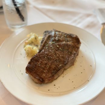 Eddie V's Prime Seafood - 18 oz USDA Prime Bone-In New York Strip - Seafood Near Me - Houston, Texas Eddie V's Prime Seafood - 18 oz USDA Prime Bone-In New York Strip - Seafood Near Me - Houston, Texas