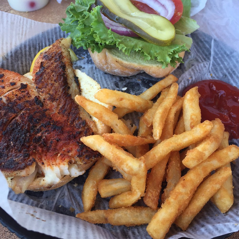 Coconuts On The Beach - Dry grouper sandwich. I ordered blackened, but this tasted like Cajun and was spicy and no tartar sauce. - Bars Near Me - Cocoa Beach, Florida Coconuts On The Beach - Dry grouper sandwich. I ordered blackened, but this tasted like Cajun and was spicy and no tartar sauce. - Bars Near Me - Cocoa Beach, Florida