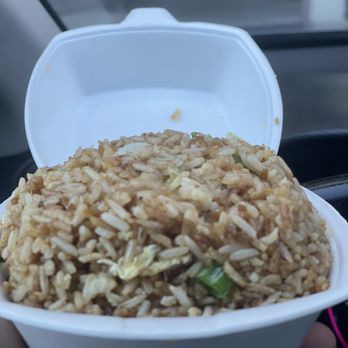 Wok On The Wild Side - a hand holding a container of rice - Chinese Near Me - Inglewood, California Wok On The Wild Side - a hand holding a container of rice - Chinese Near Me - Inglewood, California