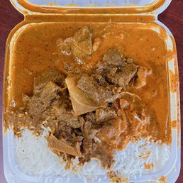 2 Item Combo ($15.99) - Butter Chicken Curry & Goat Curry (extra $1.50 charge) - Above View 2 Item Combo ($15.99) - Butter Chicken Curry & Goat Curry (extra $1.50 charge) - Above View