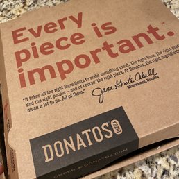 a box of pizza on a counter