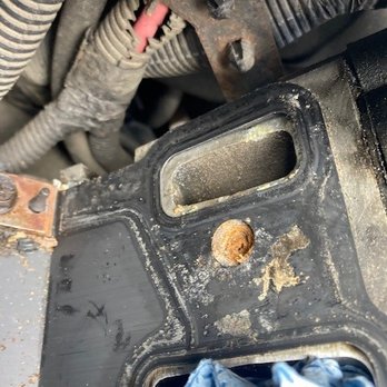 Sullivan Tire & Auto Service - The bolt holes were full of crud, note the old antifreeze build up around the port. - Tires Near Me - Stratham, New Hampshire Sullivan Tire & Auto Service - The bolt holes were full of crud, note the old antifreeze build up around the port. - Tires Near Me - Stratham, New Hampshire