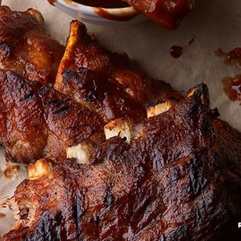 Logan's Roadhouse - Logan's Famous Baby Back Ribs: Slow-roasted for eight hours before being slathered with a savory BBQ sauce. - Steakhouses Near Me - Goldsboro, North Carolina Logan's Roadhouse - Logan's Famous Baby Back Ribs: Slow-roasted for eight hours before being slathered with a savory BBQ sauce. - Steakhouses Near Me - Goldsboro, North Carolina