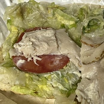 Acoustic Cafe - a chicken sandwich with lettuce and tomato - Coffee & Tea Near Me - Eau Claire, Wisconsin