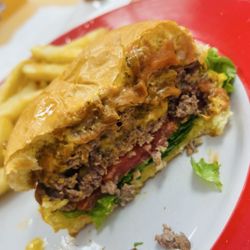 Ormond Beach Diner - Their competition Double stack smash burger w/ sweet grilled onions, Cheese, tomato lettuce