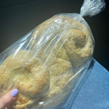 Great Harvest Bread - a person holding a bag of bread - Bakeries Near Me - Rockford, Illinois