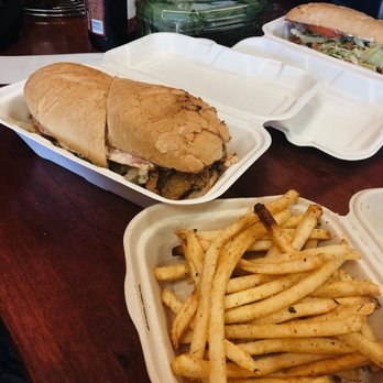 Roux Dat - fried catfish po' boy sandwich with a side of fries - Cajun/Creole Near Me - Capitola, California Roux Dat - fried catfish po' boy sandwich with a side of fries - Cajun/Creole Near Me - Capitola, California