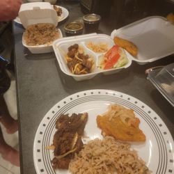 Nardette Takeout Restaurant - Griot, rice with pigeon peas, fried plantains topped with pikliz.