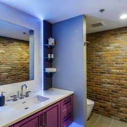 Absolute 47 - Modern rest room with TOTO Smart Toilet, electric frosted door and LED mood lighting.