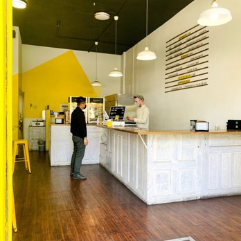 Empanada Kitchen - Inside - simple love the yellow - Empanadas Near Me - San Diego, California
