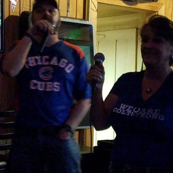 West Winds - a man and a woman holding microphones - Bars Near Me - South Bend, Indiana