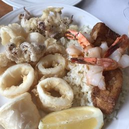 Shrimp and calamari with rice and Greek potato Shrimp and calamari with rice and Greek potato