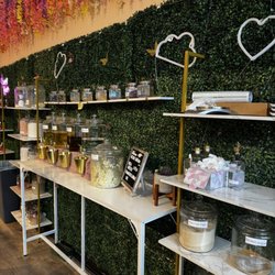 The Butta Bar by SheButta - Wall lined with fragrances, oils, and scrubs