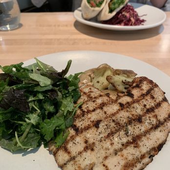 Sachet - Chicken Paillard and in the back Pita From the Wood Oven - Mediterranean Near Me - Dallas, Texas Sachet - Chicken Paillard and in the back Pita From the Wood Oven - Mediterranean Near Me - Dallas, Texas
