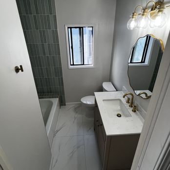 Jaber Remodeling - Full bath with lights on - Painters Near Me