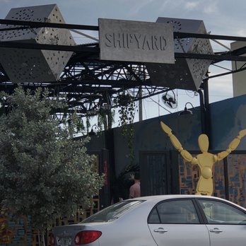 Shipyard Garden - a car parked in front of a statue - Food Court Near Me - Hollywood, Florida