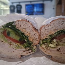 Mom And Pop Sandwiches - Roasted chicken breast on whole wheat, Swiss cheese, lettuce, tomatoes, cucumbers, green peppers with Dijon mustard.