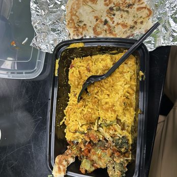 Green Leaf Grill - Coconut curry added chicken with white rice and garlic na'an on the side!! - American Near Me - Little Rock, Arkansas Green Leaf Grill - Coconut curry added chicken with white rice and garlic na'an on the side!! - American Near Me - Little Rock, Arkansas