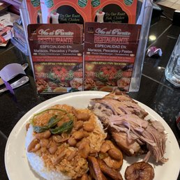 Roasted pork, white rice, pink beans with yellow bananas