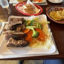 1/2 order of pork ribs w veggies and a med order of tostones