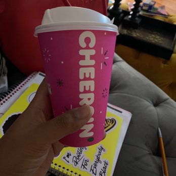 Dunkin' - a person holding a cup of coffee - Coffee & Tea Near Me - Baltimore, Maryland Dunkin' - a person holding a cup of coffee - Coffee & Tea Near Me - Baltimore, Maryland