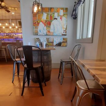 Hollands - a dining room with a table and chairs - American Near Me - Suffolk, Virginia