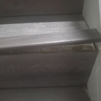 MJ Global Solutions - a close up of a set of stairs - Flooring Near Me MJ Global Solutions - a close up of a set of stairs - Flooring Near Me