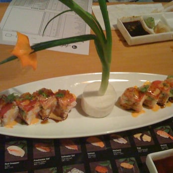 Sushi Asahi - the garnish appears to be a daikon base, with green onions and carrot - Sushi Bars Near Me - Riverside, California
