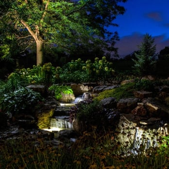 Night Light - a waterfall in a garden - Landscaping Near Me - Lombard, Illinois Night Light - a waterfall in a garden - Landscaping Near Me - Lombard, Illinois