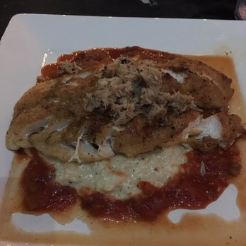 Cobalt - Bronze gold Grouper fish with creamy Parmesan risotto and a creole tomato sauce and topped with blue crab! Do not skip this meal! - Seafood Near Me - Orange Beach, Alabama Cobalt - Bronze gold Grouper fish with creamy Parmesan risotto and a creole tomato sauce and topped with blue crab! Do not skip this meal! - Seafood Near Me - Orange Beach, Alabama